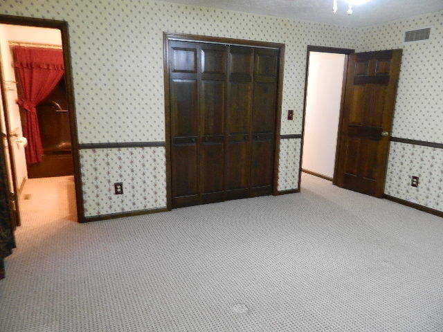 4788 Seven Hills Road Clinton, IL 61727 - Photo 40 of 46 an empty room with closet