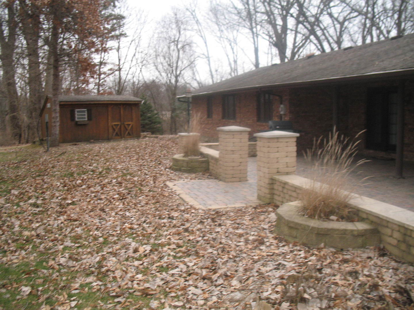 4788 Seven Hills Road Clinton, IL 61727 - Photo 6 of 46 a view of a backyard with table and chairs and a fire pit