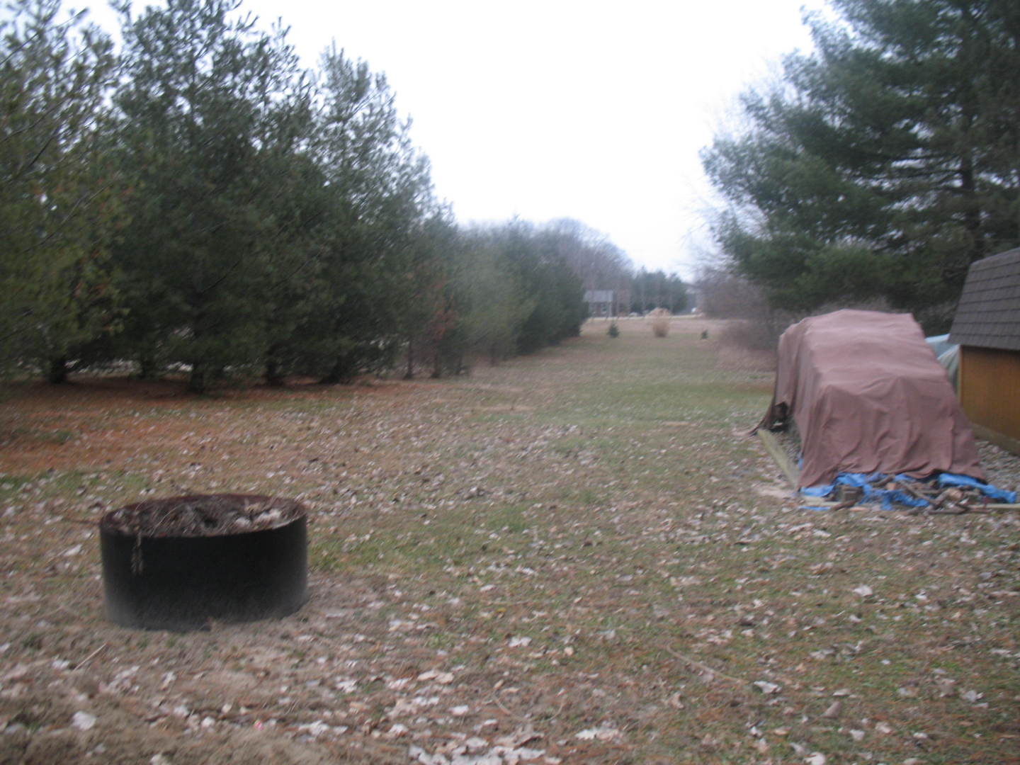 4788 Seven Hills Road Clinton, IL 61727 - Photo 9 of 46 a view of a backyard with table and chairs