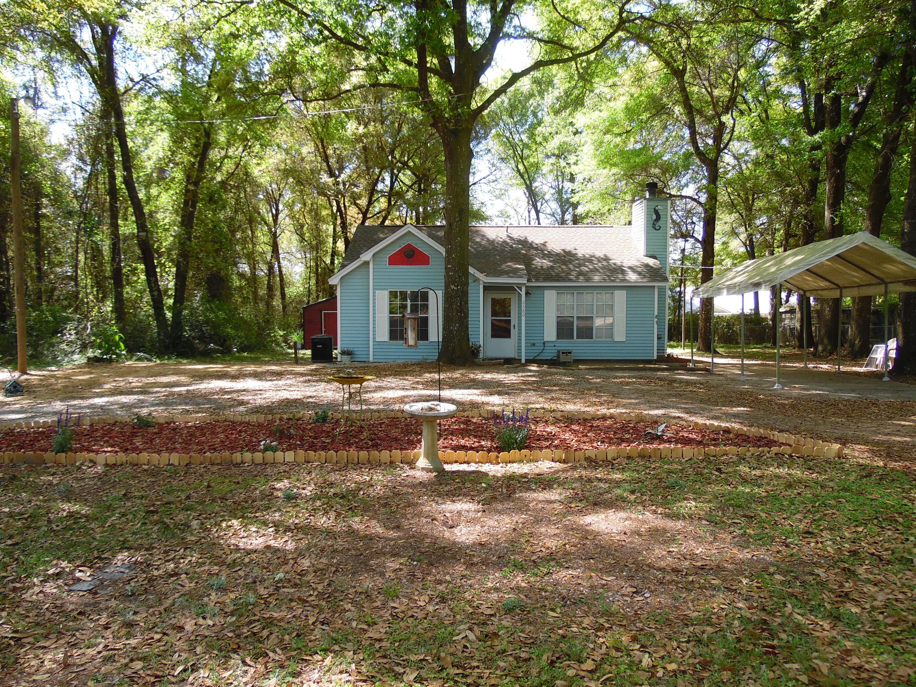 2580 Kingston Road Crestview, FL 32536 - Photo 1 of 20 a front view of a house with a yard