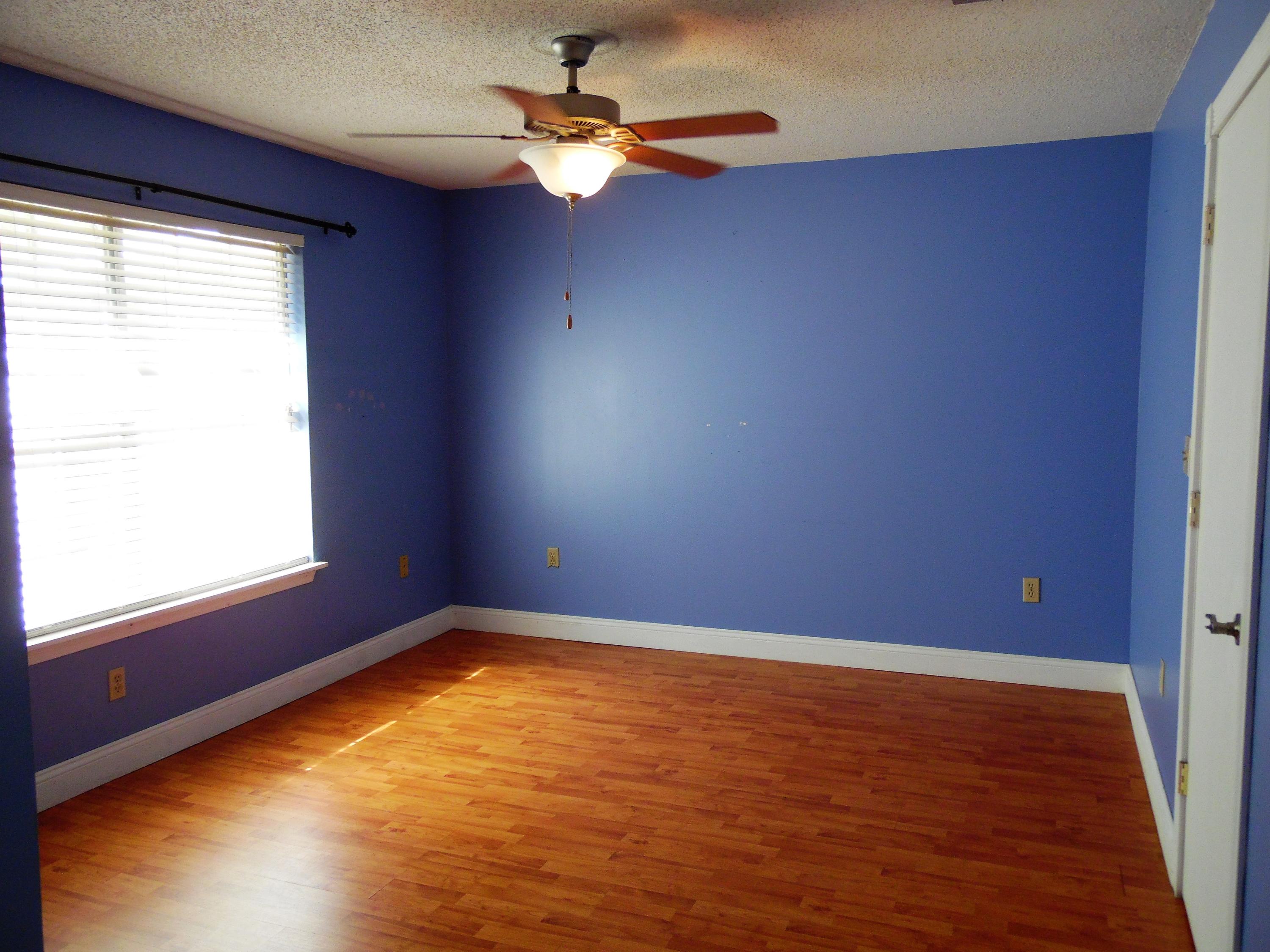 2580 Kingston Road Crestview, FL 32536 - Photo 13 of 20 an empty room with a window and a ceiling fan