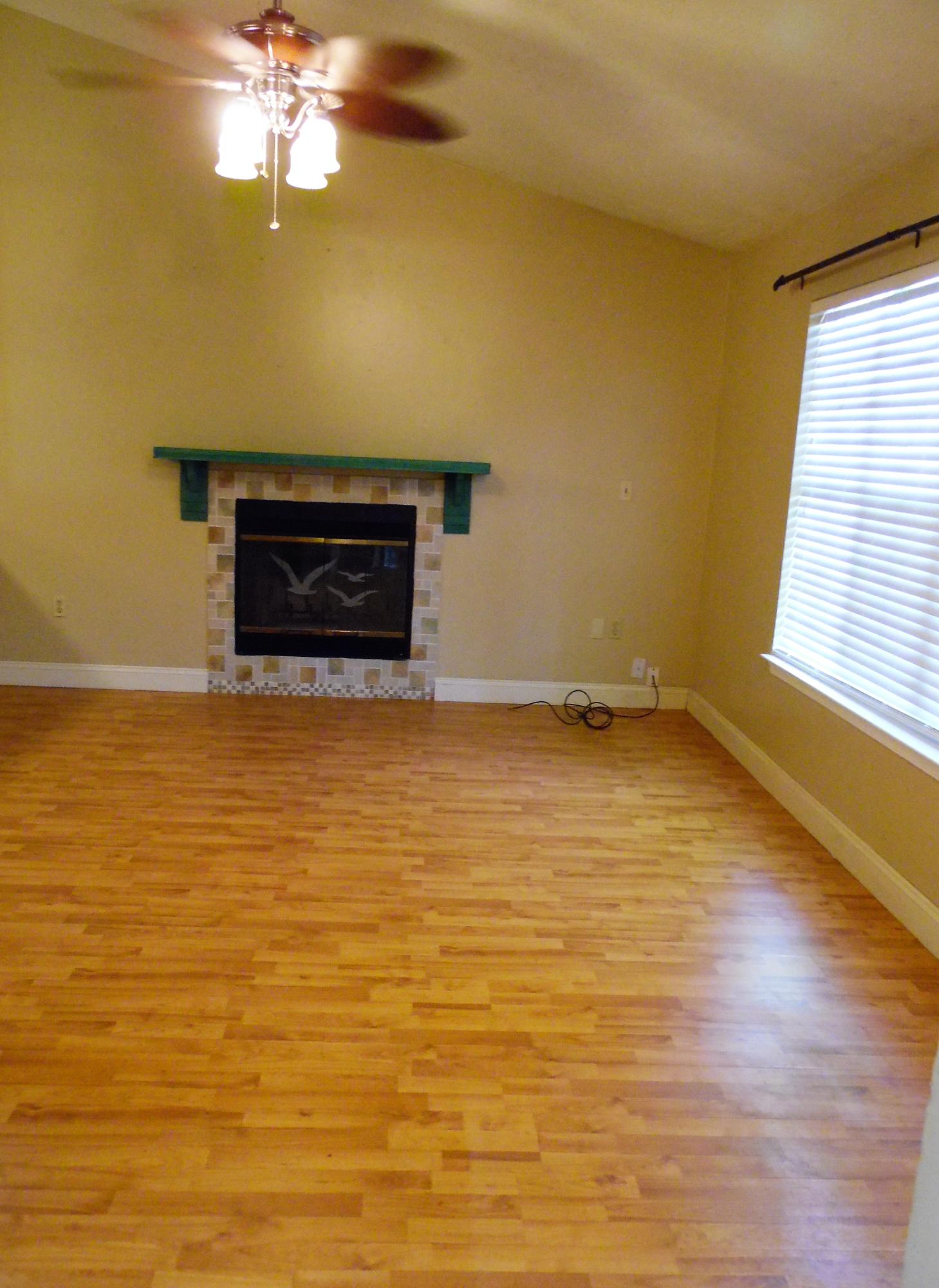2580 Kingston Road Crestview, FL 32536 - Photo 5 of 20 a view of a livingroom with an empty space and a fireplace