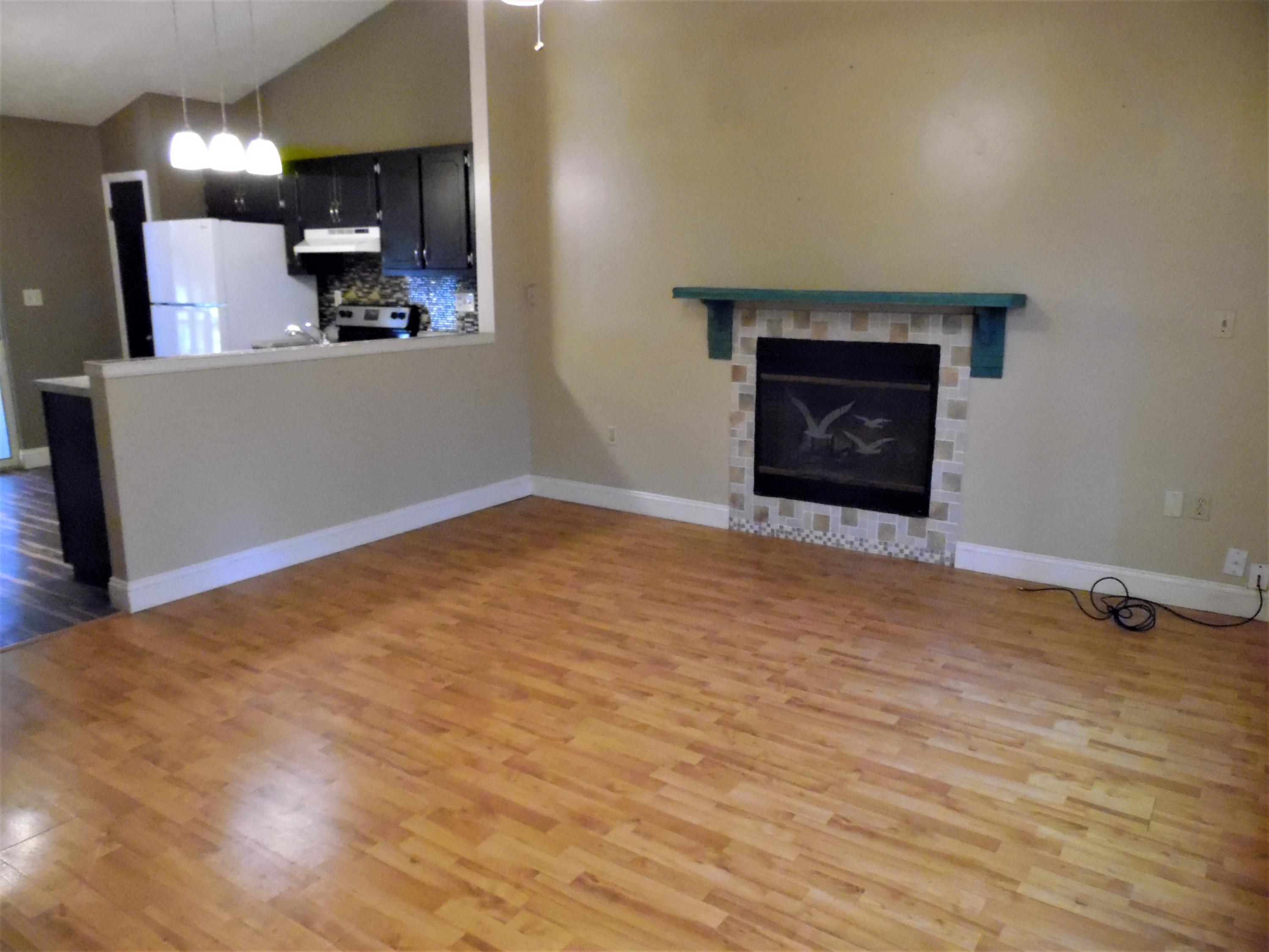 2580 Kingston Road Crestview, FL 32536 - Photo 6 of 20 a view of kitchen and empty room with wooden floor
