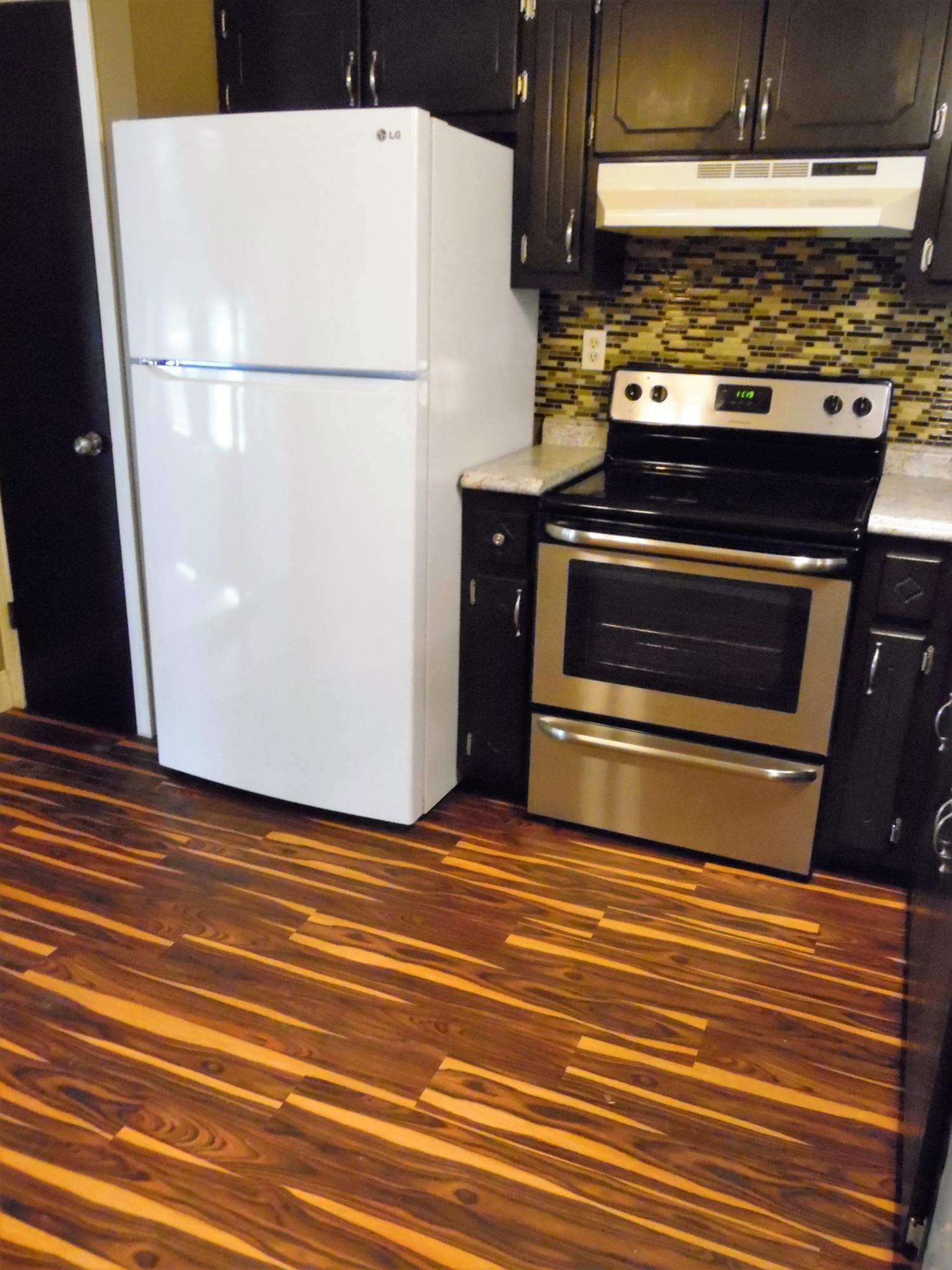 2580 Kingston Road Crestview, FL 32536 - Photo 9 of 20 a view of a stove with refrigerator and stove