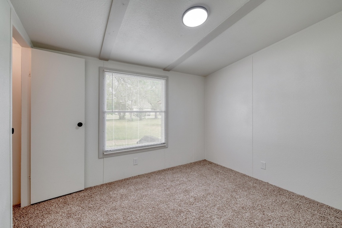 209 Fallwell Street Liberty Hill, TX 78642 - Photo 18 of 25 an empty room with a window
