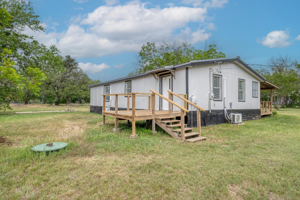209 Fallwell Street Liberty Hill, TX 78642 - Photo 22 of 25 a house view with a backyard space