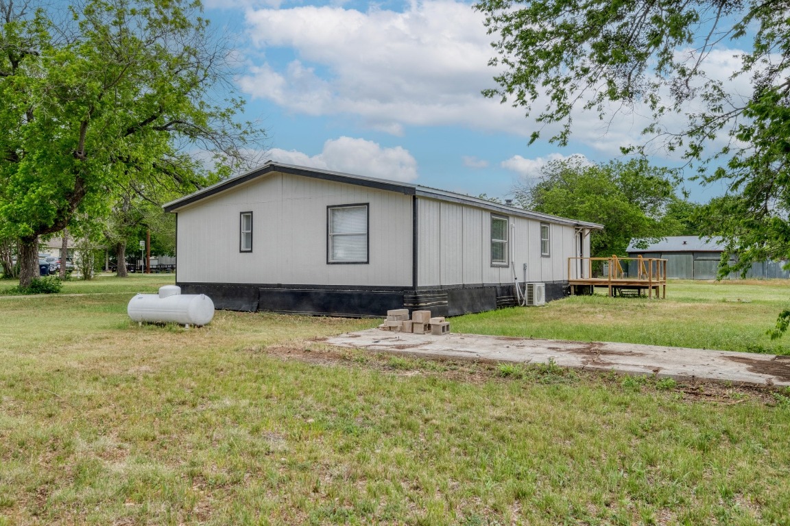 209 Fallwell Street Liberty Hill, TX 78642 - Photo 23 of 25 a view of a house with backyard and trees