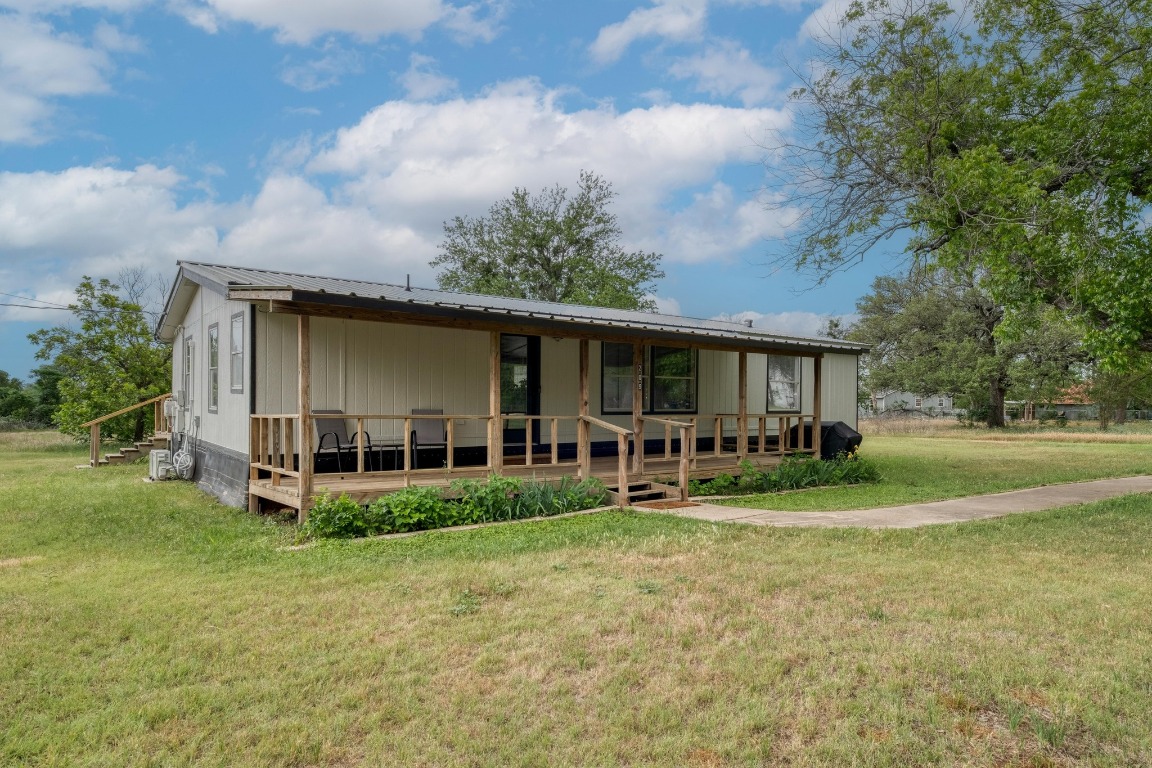 209 Fallwell Street Liberty Hill, TX 78642 - Photo 3 of 25 a view of a house with a yard and sitting area