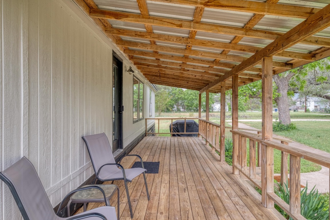 209 Fallwell Street Liberty Hill, TX 78642 - Photo 4 of 25 a view of a patio with wooden floor