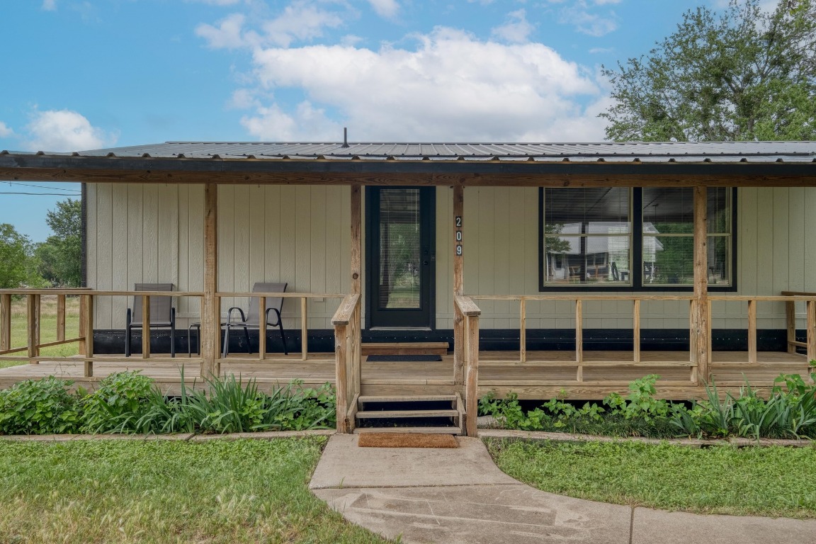 209 Fallwell Street Liberty Hill, TX 78642 - Photo 5 of 25 a view of a house with a yard and plants