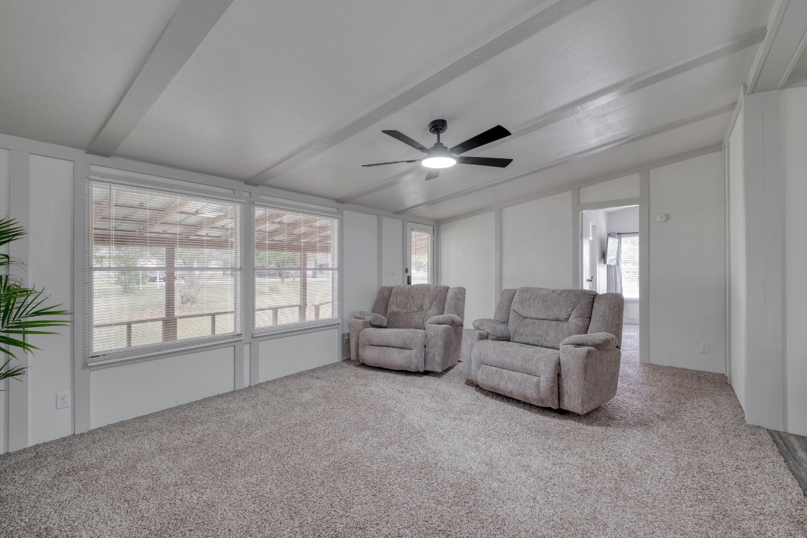 209 Fallwell Street Liberty Hill, TX 78642 - Photo 6 of 25 a living room with furniture and a large window
