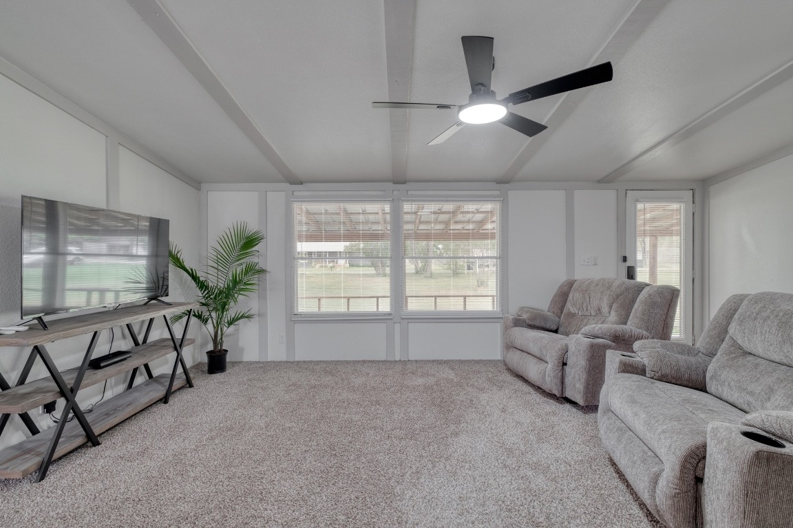 209 Fallwell Street Liberty Hill, TX 78642 - Photo 7 of 25 a living room with furniture and a flat screen tv
