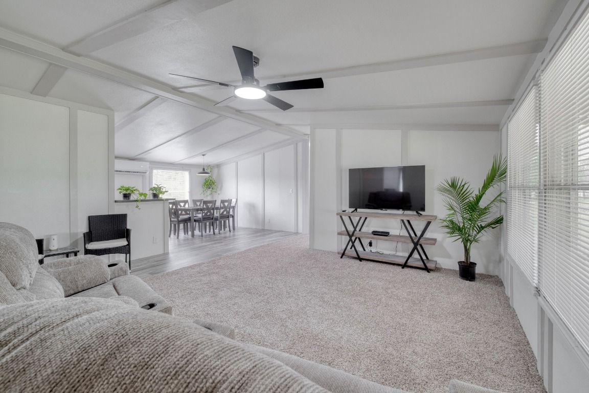 209 Fallwell Street Liberty Hill, TX 78642 - Photo 8 of 25 a living room with furniture and a flat screen tv