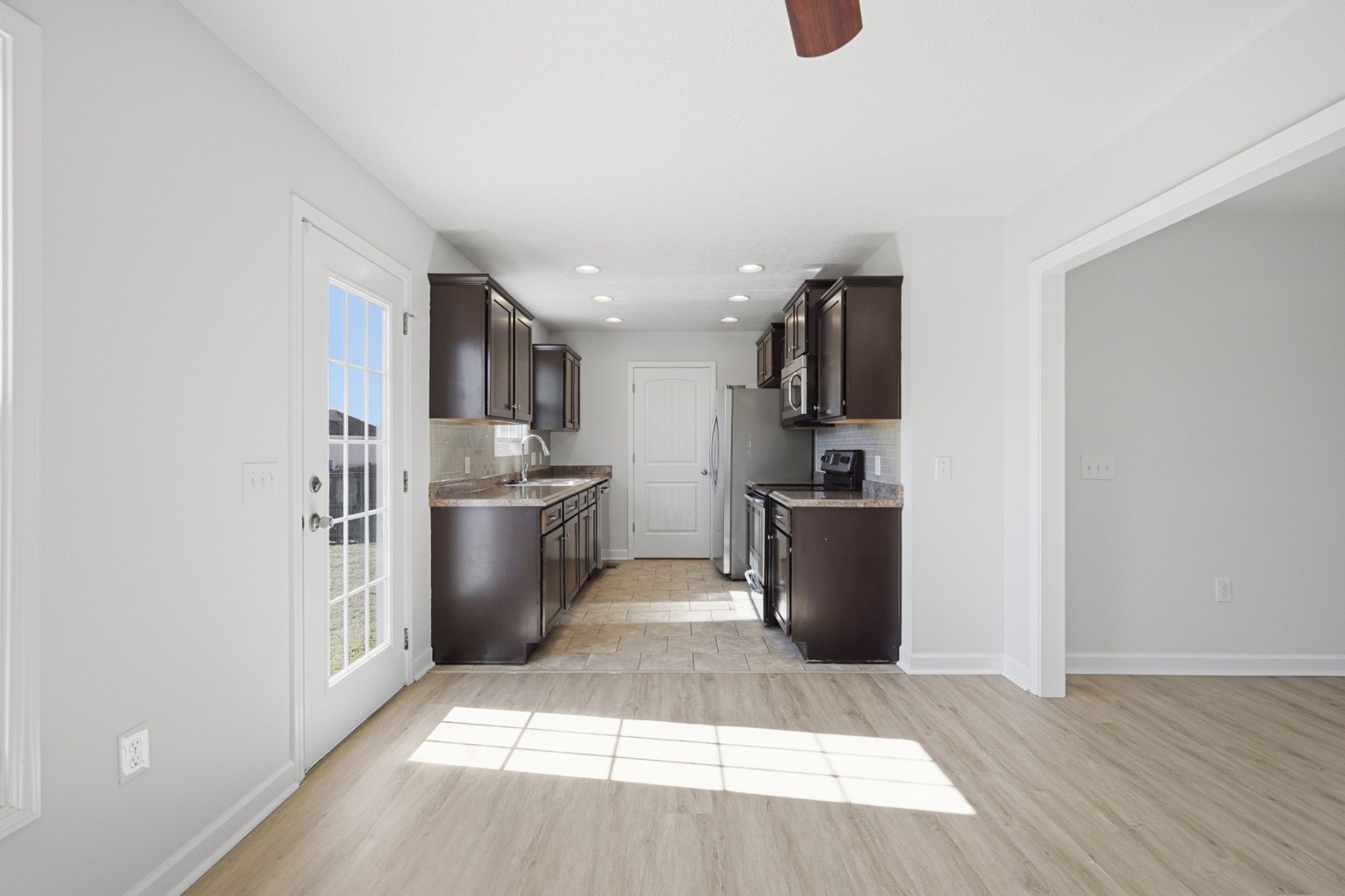 91 Creek Chase Road Manchester, TN 37355 - Photo 12 of 30 a kitchen with stainless steel appliances granite countertop a refrigerator a sink a stove and a microwave oven