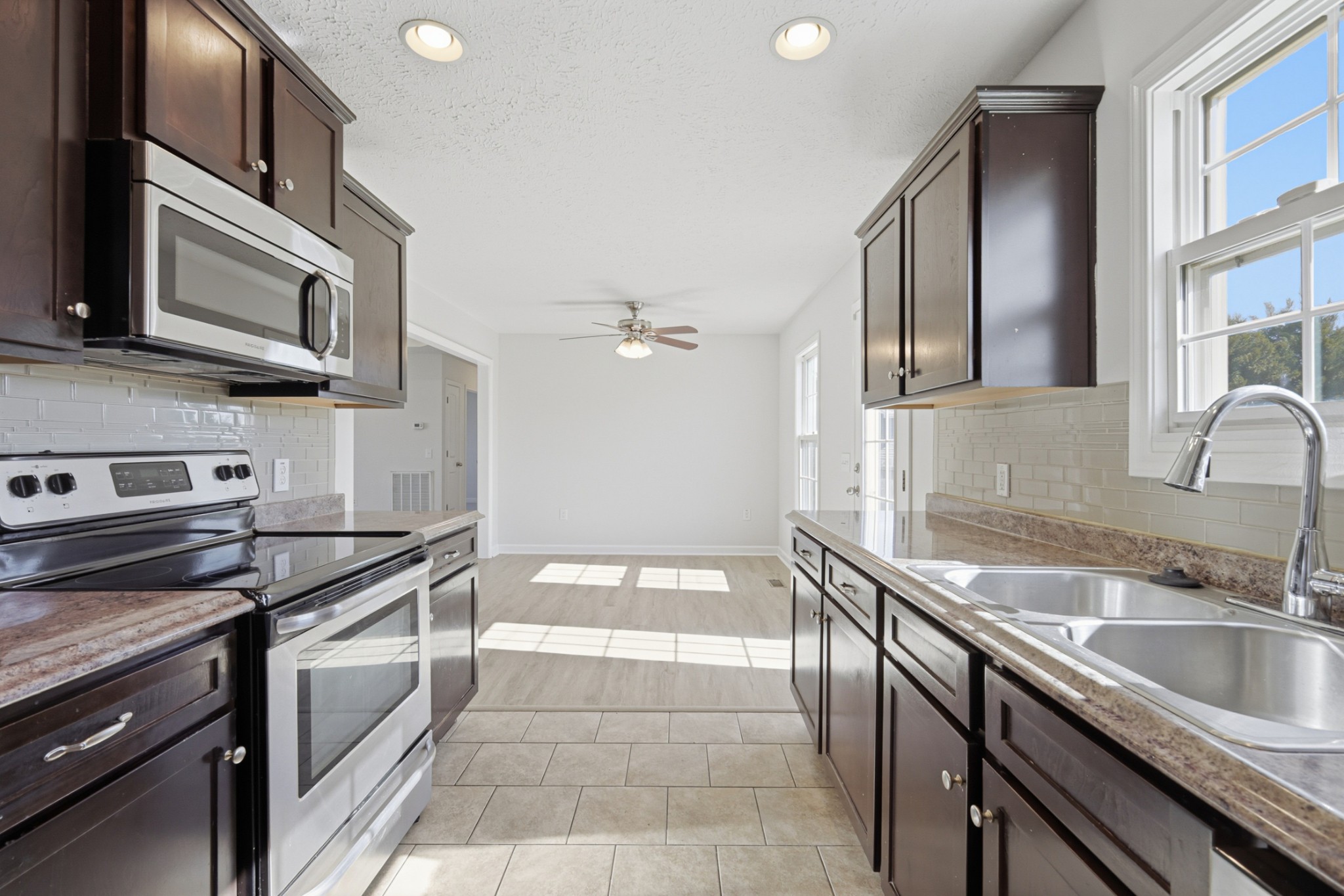 91 Creek Chase Road Manchester, TN 37355 - Photo 13 of 30 a kitchen with a sink stove and microwave