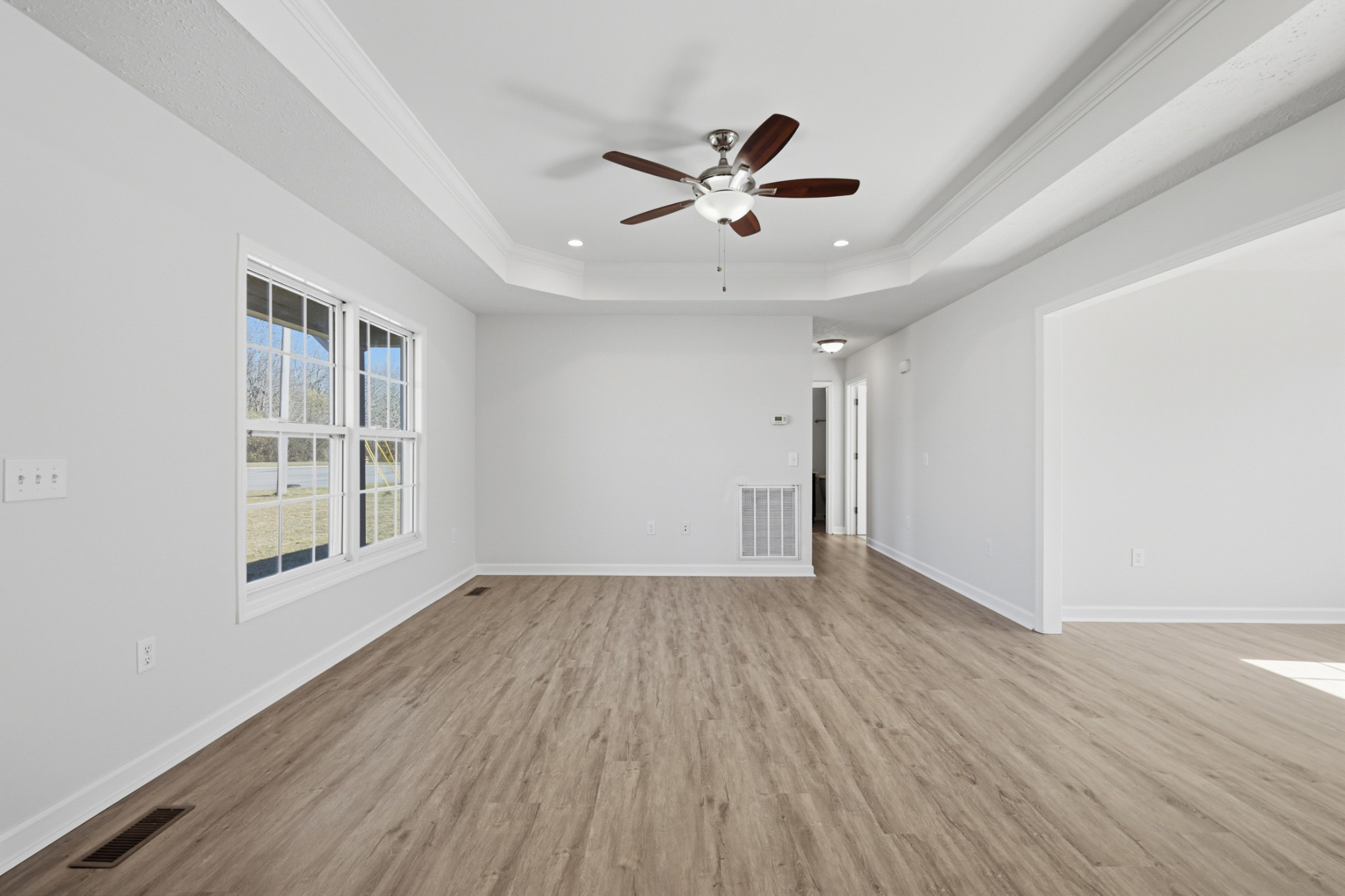 91 Creek Chase Road Manchester, TN 37355 - Photo 14 of 30 a view of an empty room with wooden floor and a window