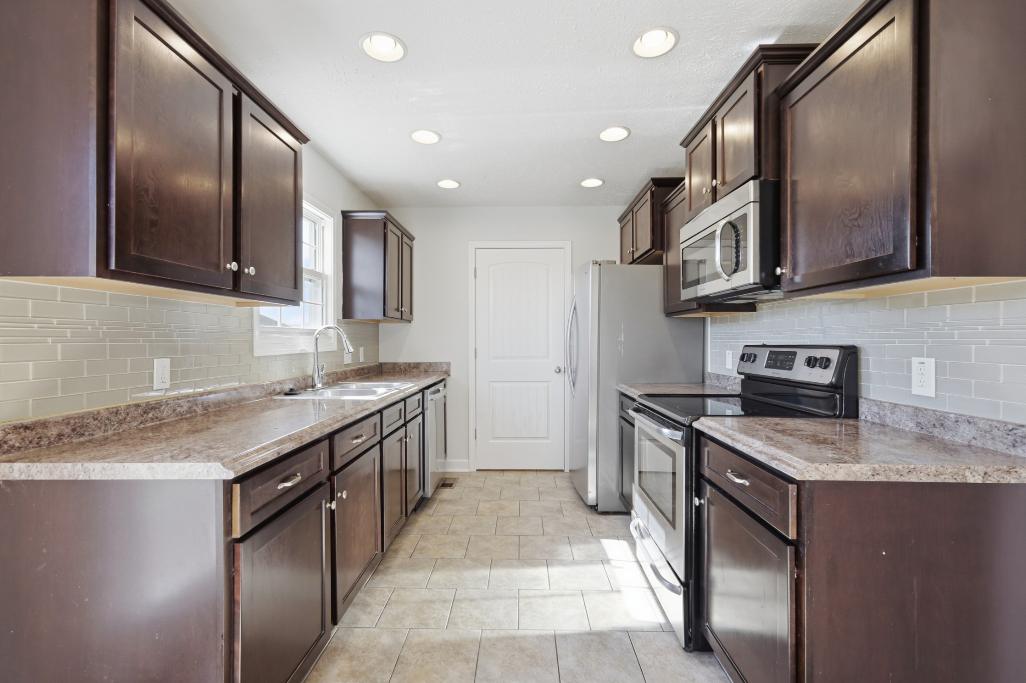 91 Creek Chase Road Manchester, TN 37355 - Photo 2 of 30 a kitchen with stainless steel appliances granite countertop a sink and a stove
