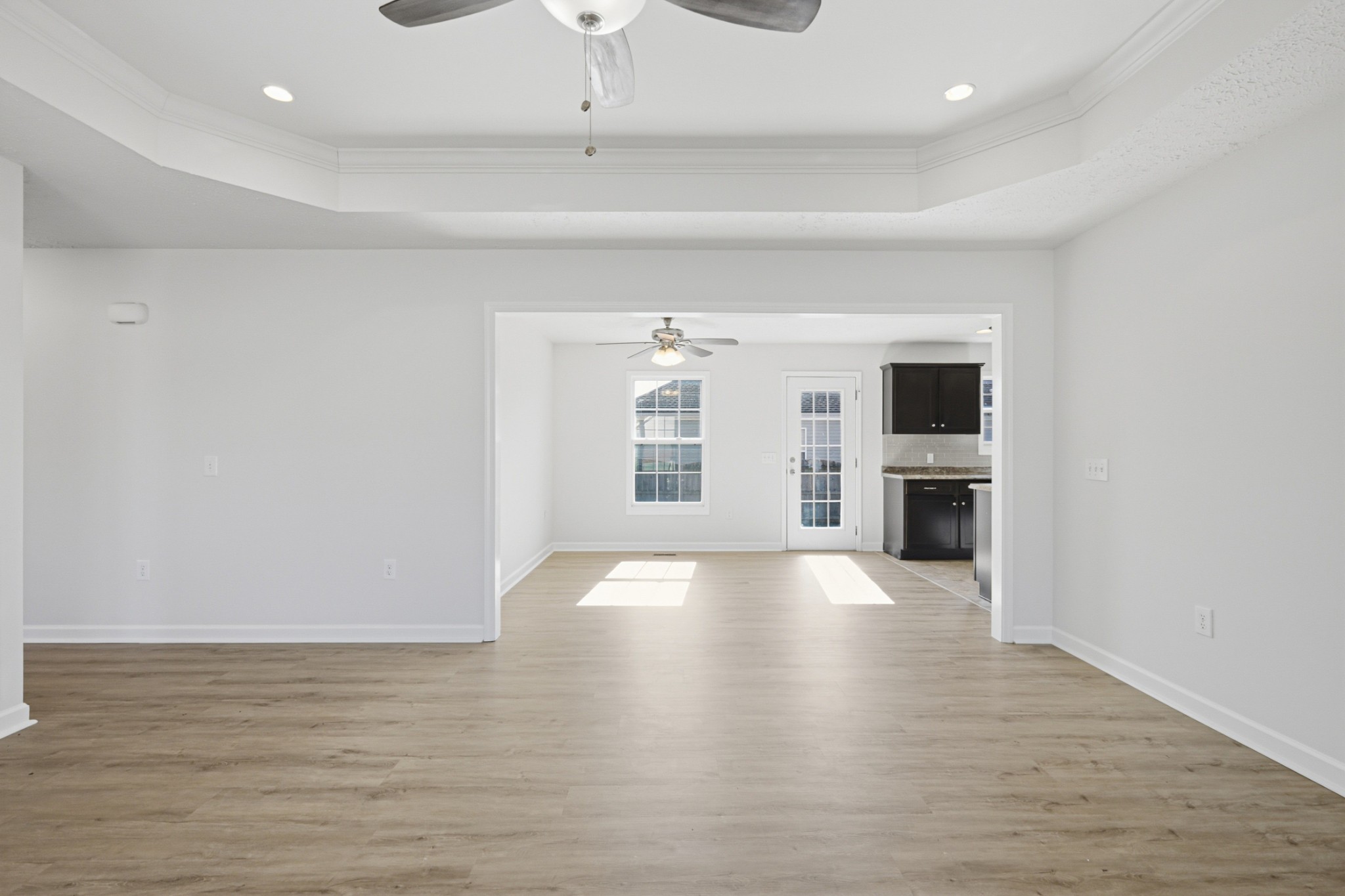 91 Creek Chase Road Manchester, TN 37355 - Photo 8 of 30 a view of an empty room with a kitchen and a window