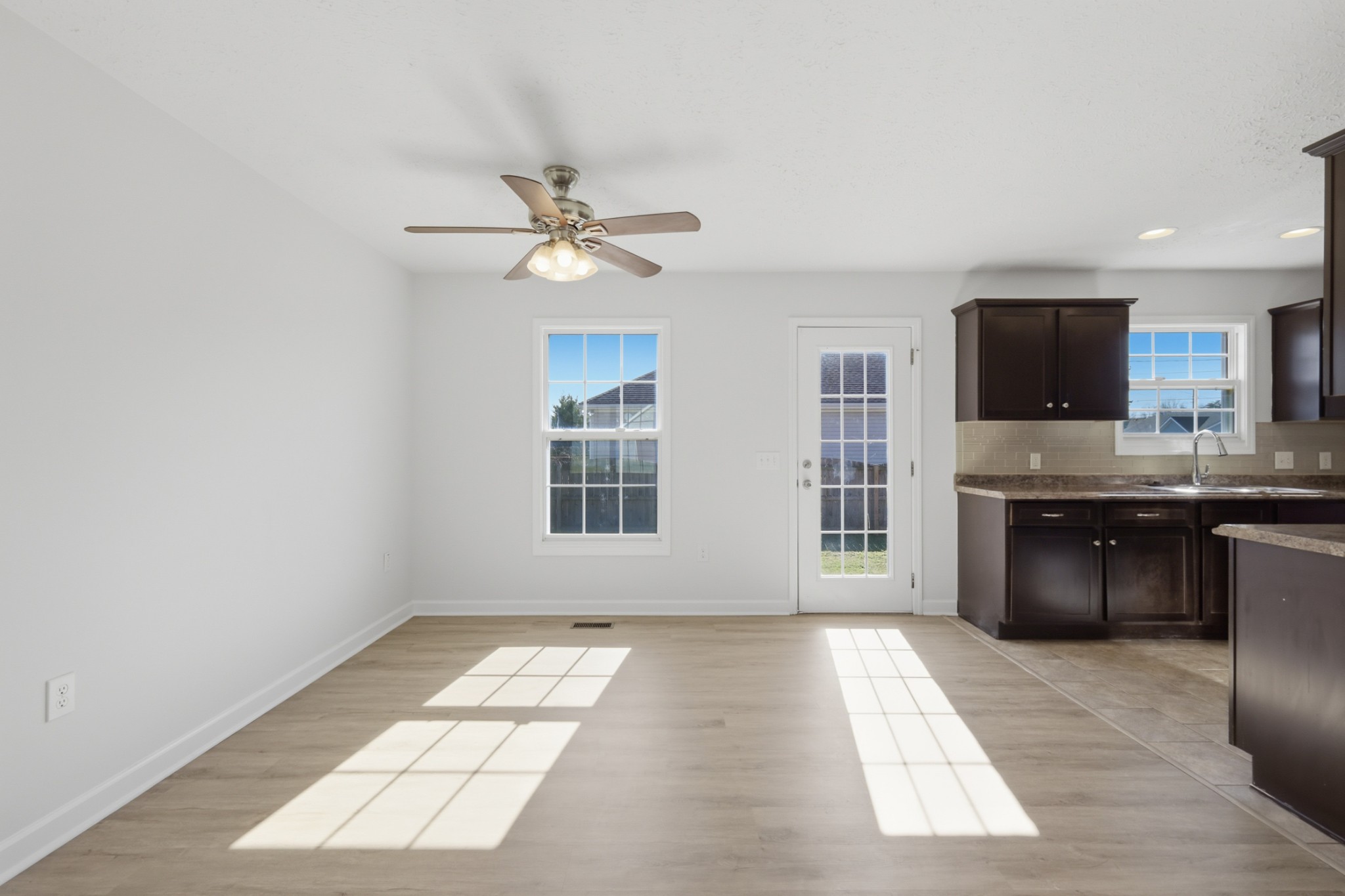 91 Creek Chase Road Manchester, TN 37355 - Photo 9 of 30 a view of kitchen with granite countertop cabinets a stove a sink and a window