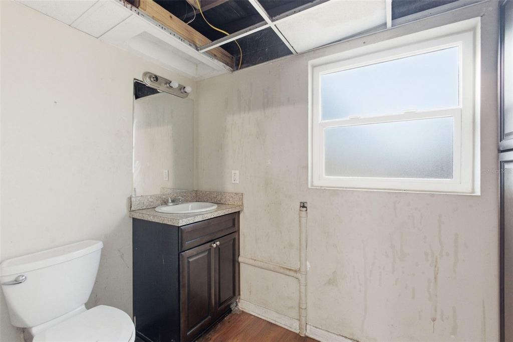 762 Valencia Avenue Orange City, FL 32763 - Photo 15 of 39 a bathroom with a toilet sink vanity and mirror