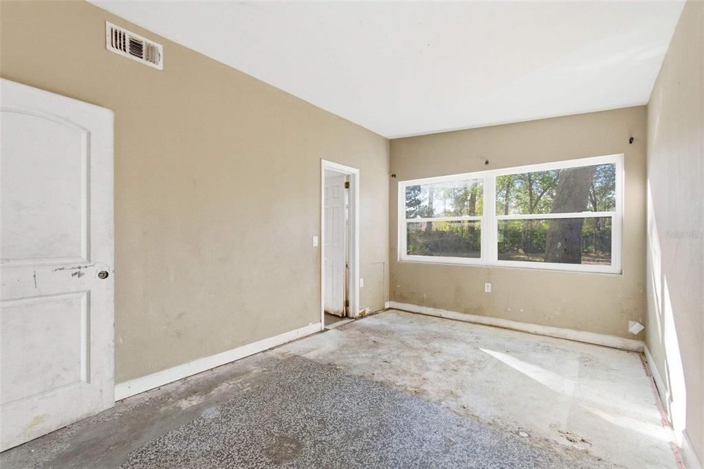 762 Valencia Avenue Orange City, FL 32763 - Photo 18 of 39 a view of an empty room with a window