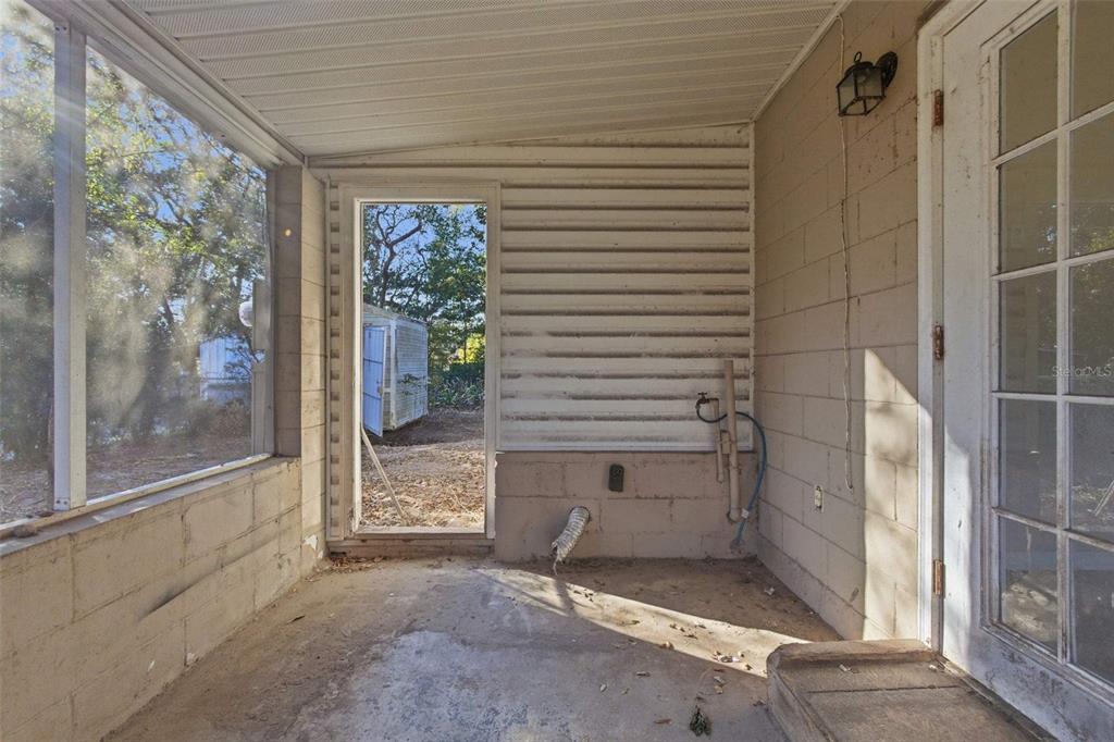 762 Valencia Avenue Orange City, FL 32763 - Photo 20 of 39 a view of a door and chair in a room