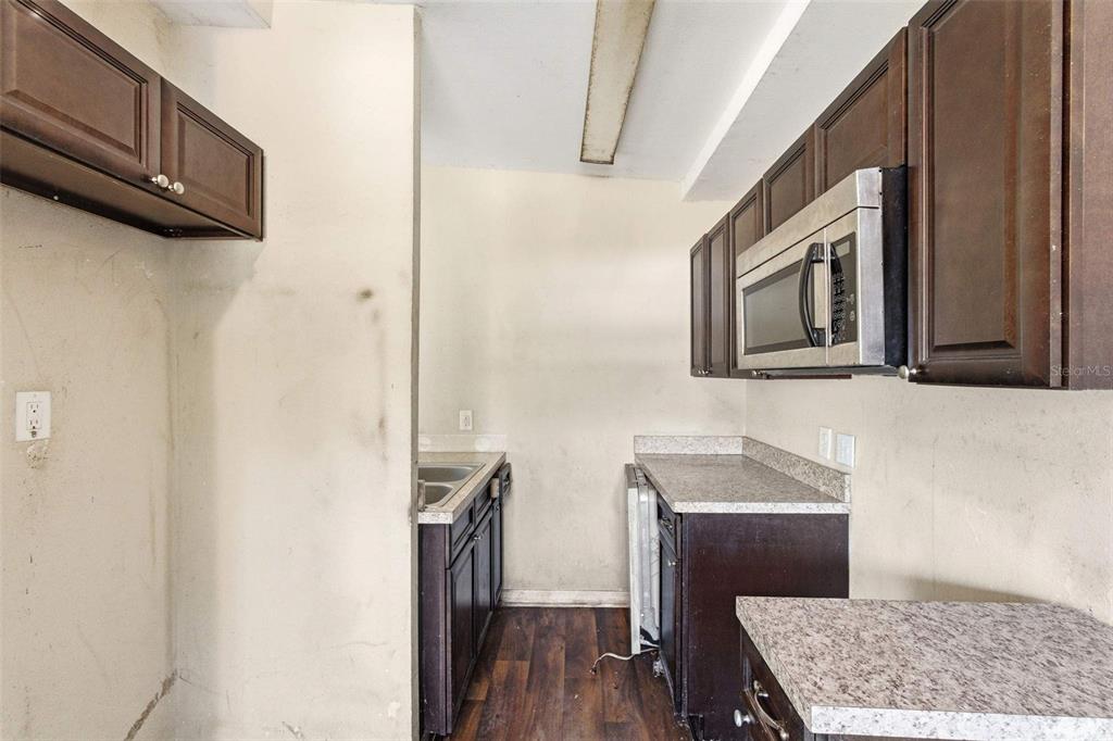 762 Valencia Avenue Orange City, FL 32763 - Photo 25 of 39 a bathroom with a sink a mirror and wooden floor