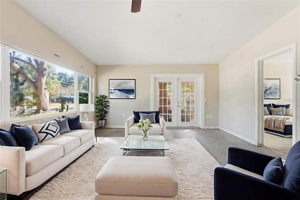 762 Valencia Avenue Orange City, FL 32763 - Photo 6 of 39 a living room with furniture and a large window