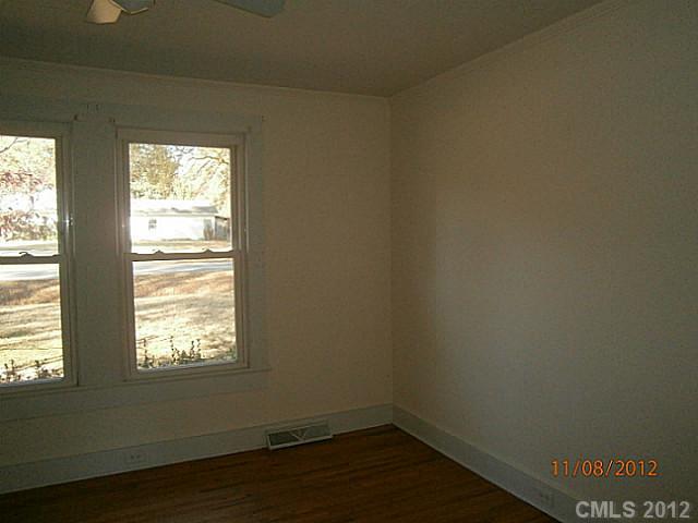 1501 South Ridge Avenue Kannapolis, NC 28083 - Photo 6 of 9 a view of empty room with wooden floor and fan
