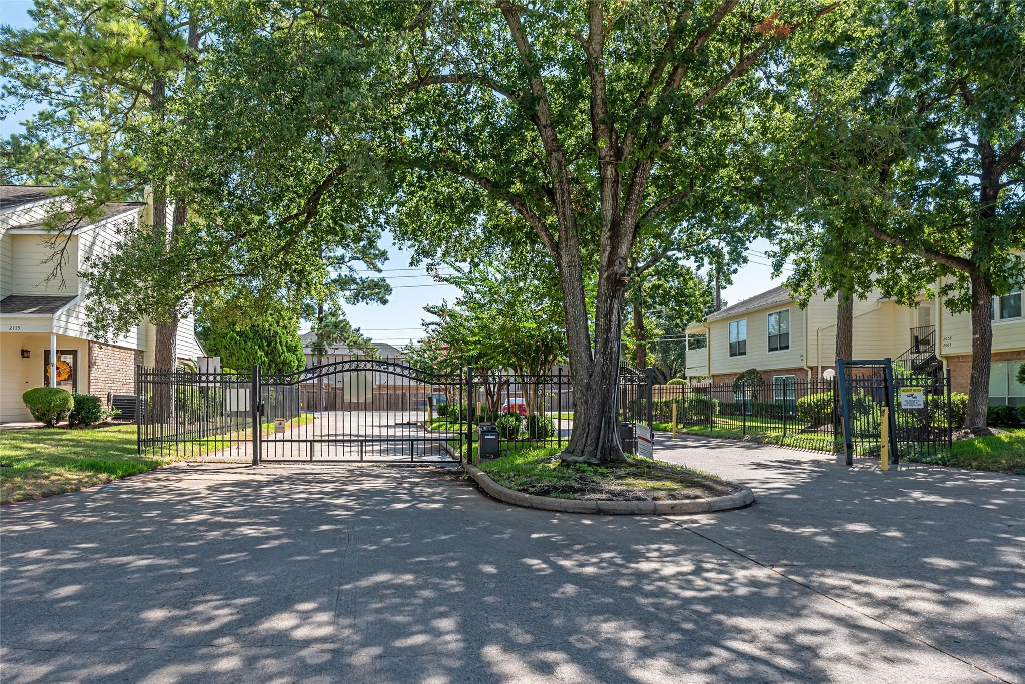 14515 Wunderlich Drive, Unit 306 Houston, TX 77069 - Photo 16 of 24 a view of road with trees