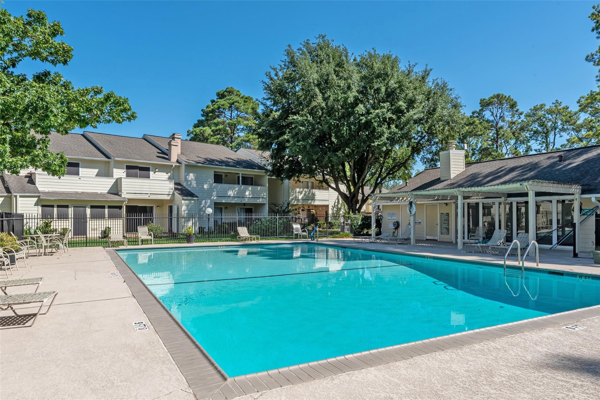 14515 Wunderlich Drive, Unit 306 Houston, TX 77069 - Photo 17 of 24 a view of a house with swimming pool