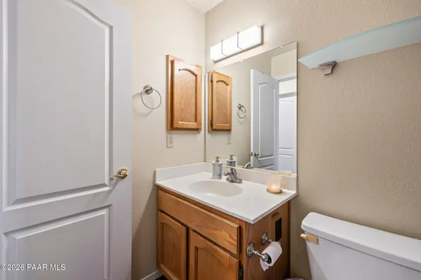 a bathroom with a shower curtain and sink