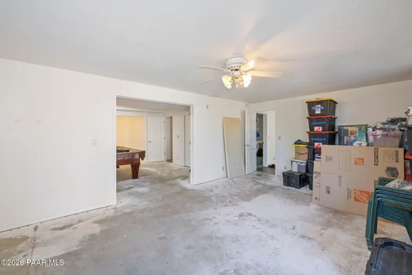 a room with furniture and gym equipment