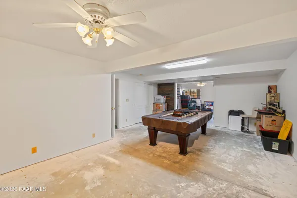 a kitchen with stainless steel appliances granite countertop a sink and cabinets with wooden floor