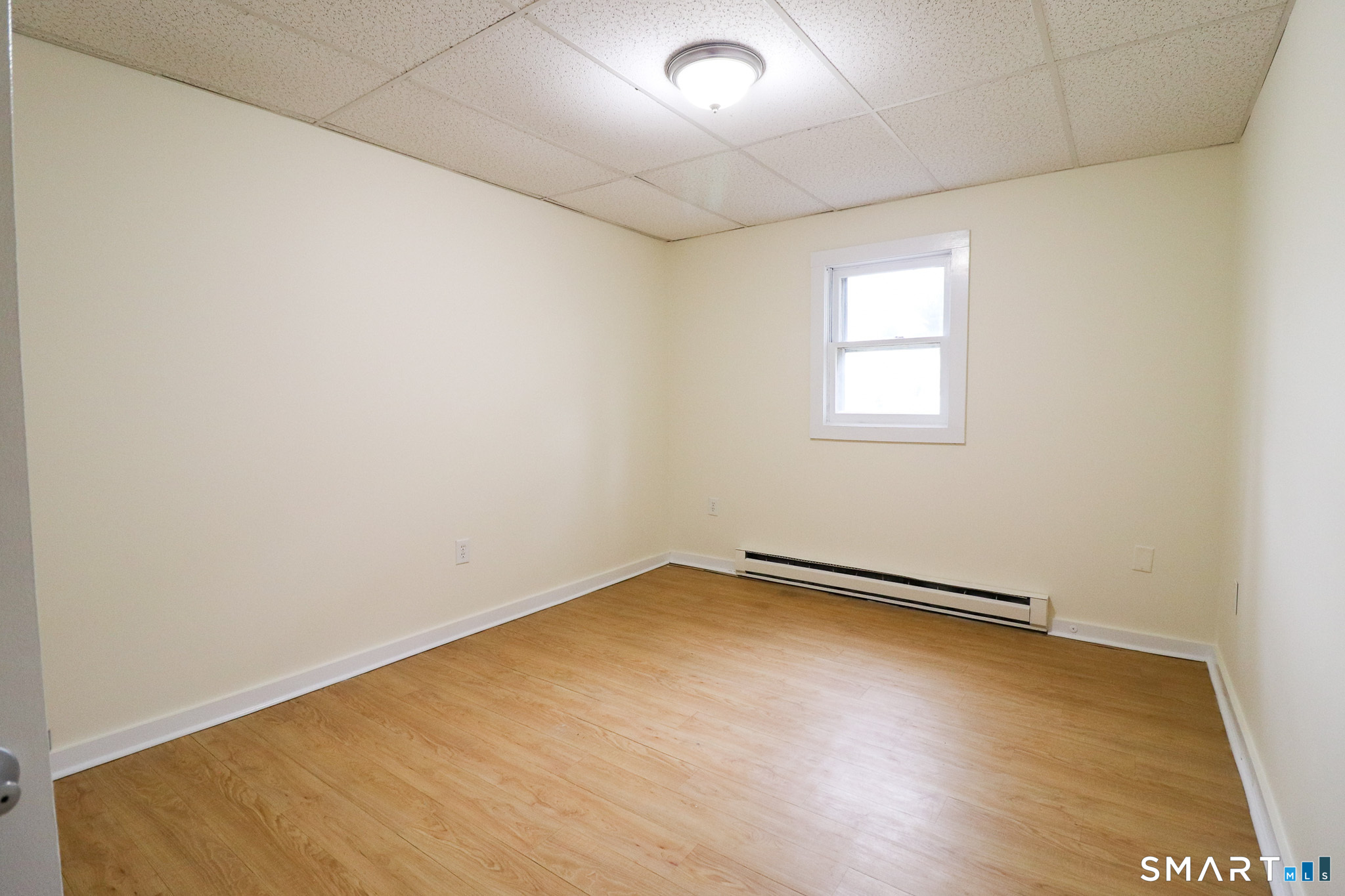 374 Main Street, Unit C Niantic, CT 06357 - Photo 12 of 31 an empty room with a empty space and window