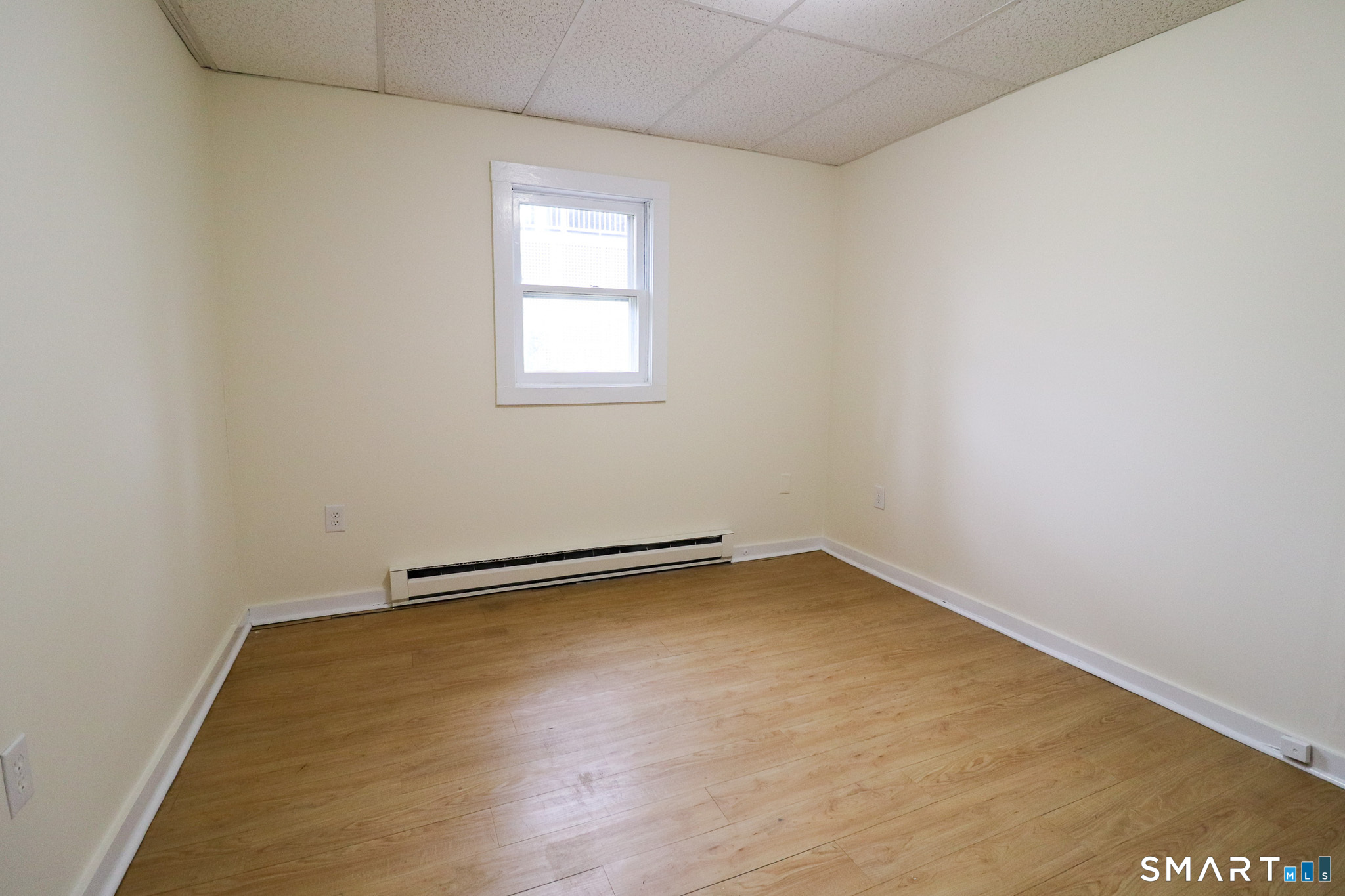 374 Main Street, Unit C Niantic, CT 06357 - Photo 14 of 31 an empty room with a window