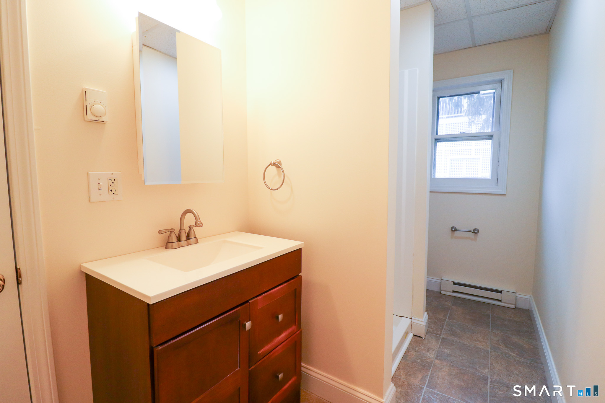 374 Main Street, Unit C Niantic, CT 06357 - Photo 15 of 31 a bathroom with a sink and a mirror
