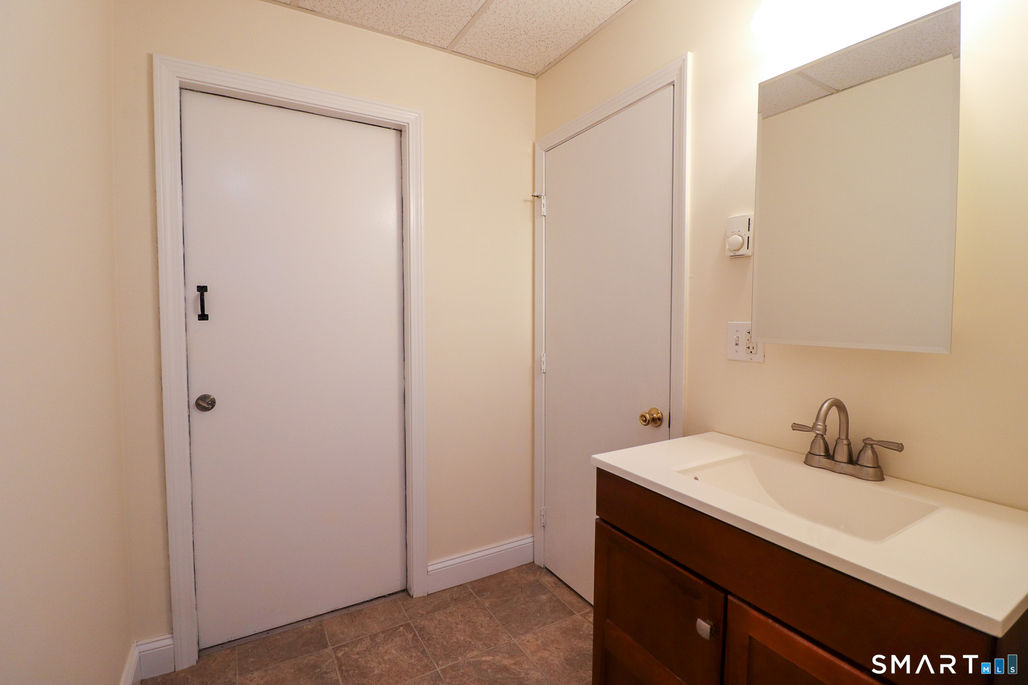 374 Main Street, Unit C Niantic, CT 06357 - Photo 16 of 31 a bathroom with a sink and a mirror