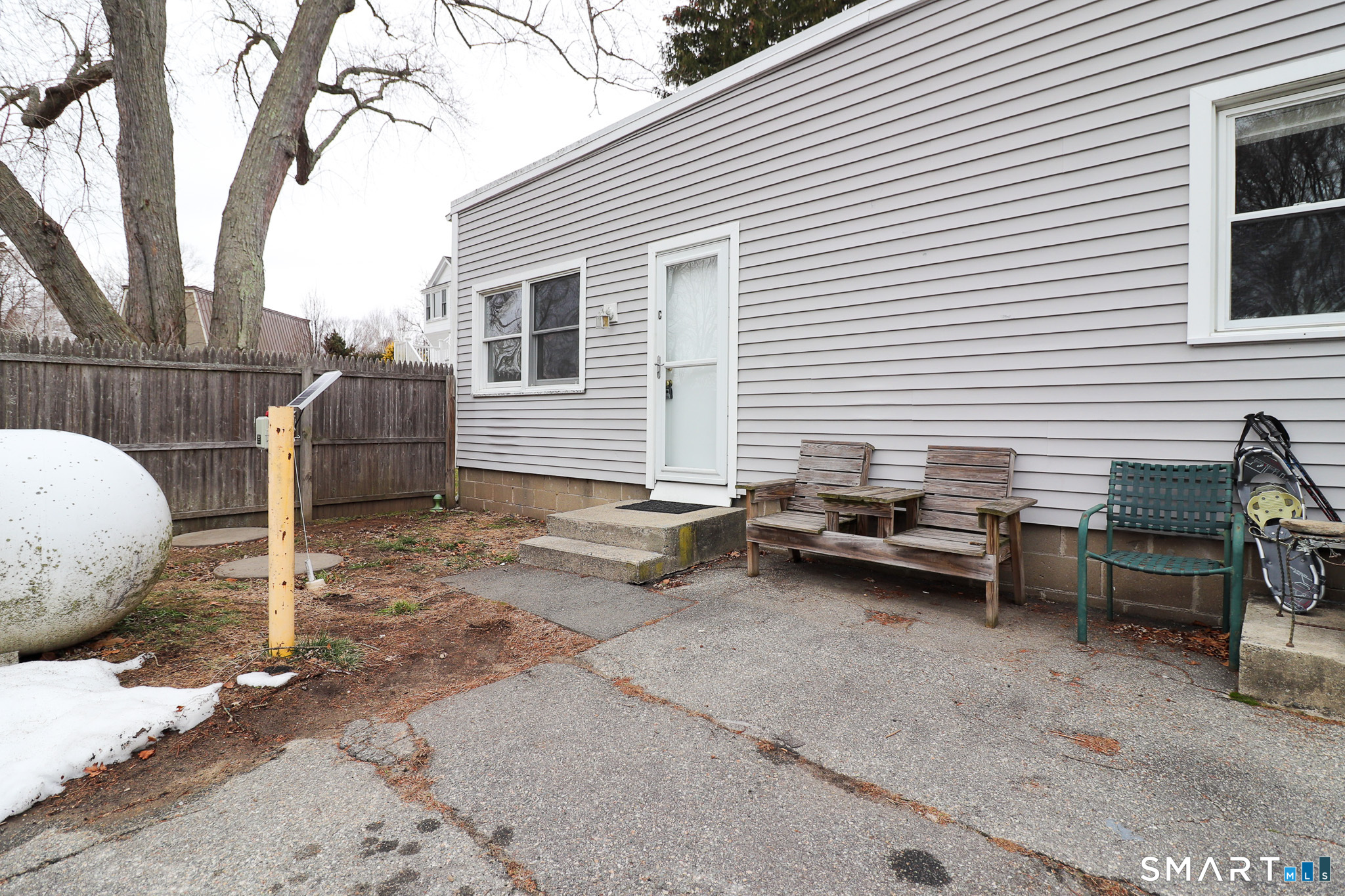 374 Main Street, Unit C Niantic, CT 06357 - Photo 18 of 31 a backyard of a house with barbeque oven table and chairs