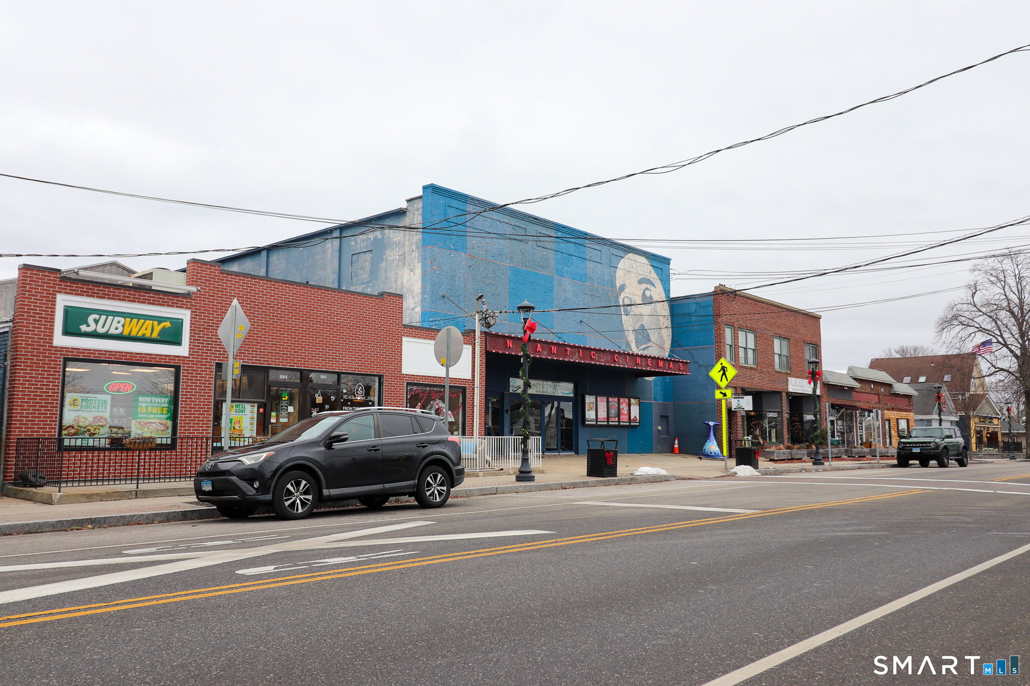 374 Main Street, Unit C Niantic, CT 06357 - Photo 28 of 31 a car parked in front of a building