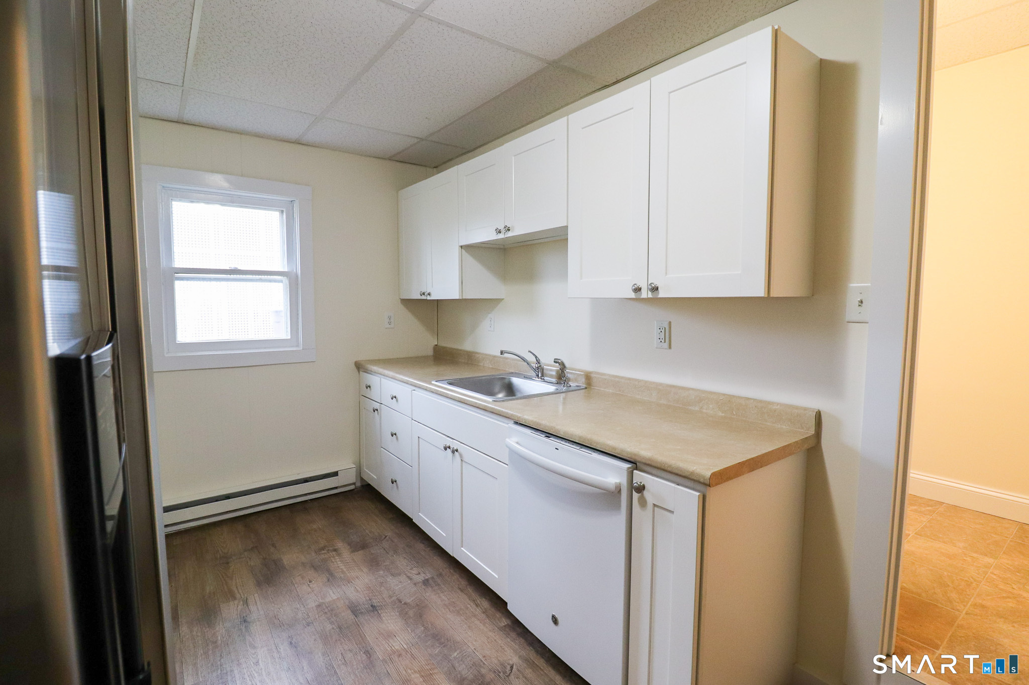 374 Main Street, Unit C Niantic, CT 06357 - Photo 7 of 31 a utility room with granite countertop cabinets washer and dryer