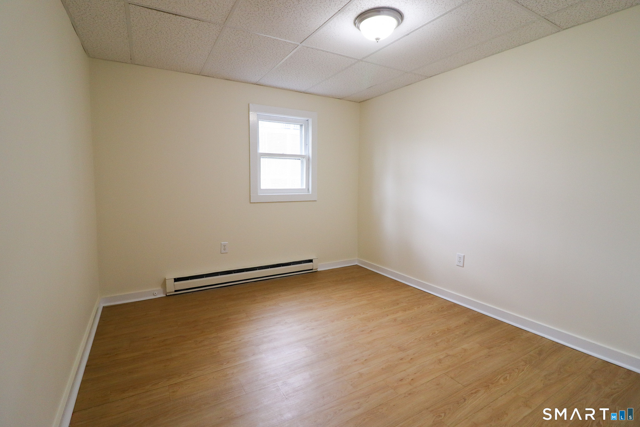 374 Main Street, Unit C Niantic, CT 06357 - Photo 9 of 31 an empty room with a empty space and a window