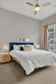 a bedroom with a bed and window