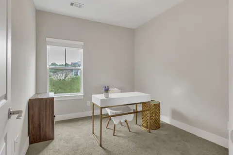 a room with a table and windows