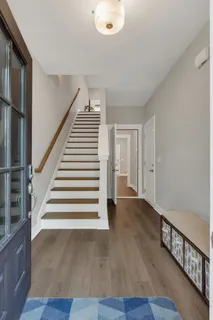 a view of entryway with wooden floor