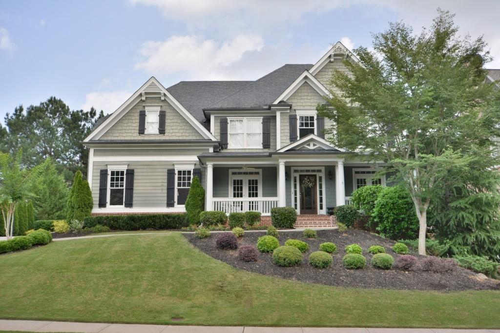 6192 Grand Loop Road Sugar Hill, GA 30518 - Photo 1 of 1 a front view of a house with garden