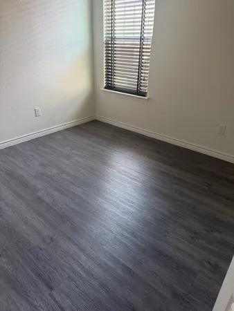 a bathroom with a bathtub and toilet