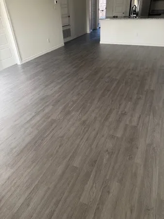 a view of a kitchen from a hallway