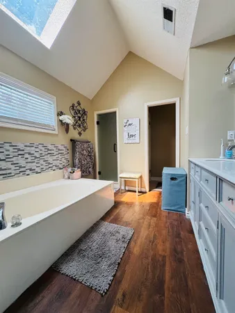 a spacious bedroom with a large bed and a couch