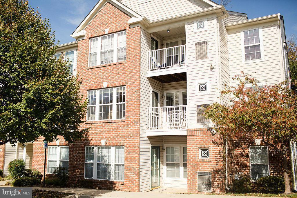 3018 Hunting Ridge Drive, Unit 3018 Owings Mills, MD 21117 - Photo 1 of 30 a view of a building with a tree